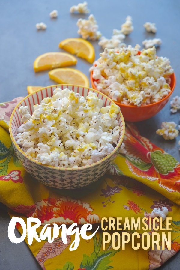 Salted Popcorn gets a tasty drizzle of creamy orange infused white chocolate in this Orange Creamsicle Popcorn. Check out the recipe on Shutterbean.com !