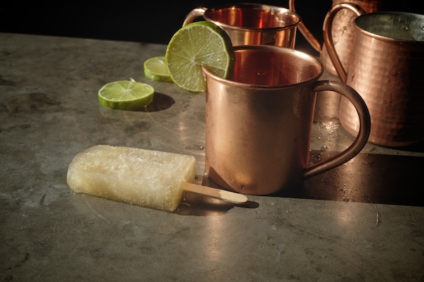 Combine your favorite cocktail with a popsicle with these Moscow Mule Popsicles! Recipe on Shutterbean.com 