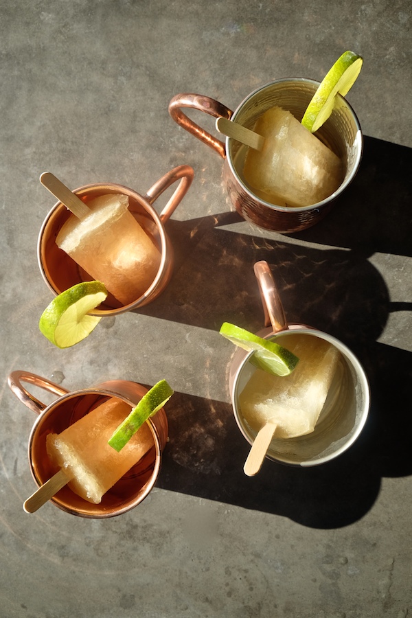 Combine your favorite cocktail with a popsicle with these Moscow Mule Popsicles! Recipe on Shutterbean.com 