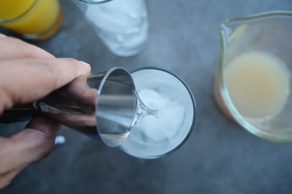 The Summer Breeze Cocktail is a delicious blend of fresh grapefruit juice, pineapple juice & gin. Find the recipe at Shutterbean.com