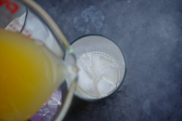 The Summer Breeze Cocktail is a delicious blend of fresh grapefruit juice, pineapple juice & gin. Find the recipe at Shutterbean.com