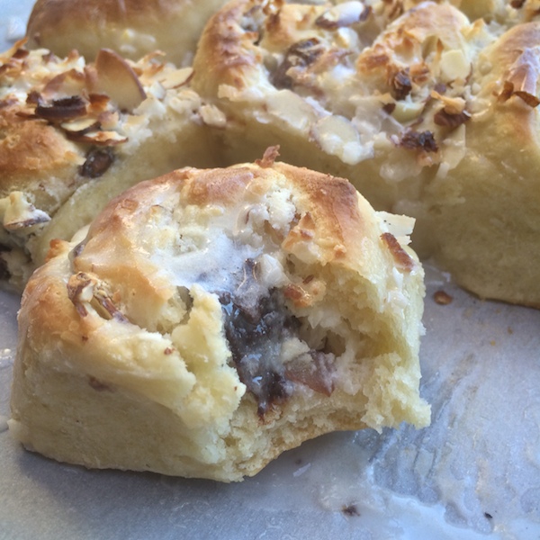 Almond Joy Rolls with coconut cream cheese filling & chunks of melted chocolate melted inside. Check out the recipe on Shutterbean.com! 