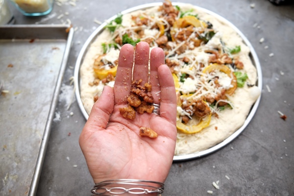 Roasted Delicata Squash Kale Pizza with sausage, caramelized onions and candied walnuts! Recipe on shutterbean.com