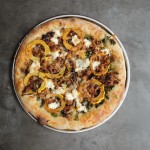 Roasted Delicata Squash Kale Pizza with sausage, caramelized onions and candied walnuts! Recipe on shutterbean.com