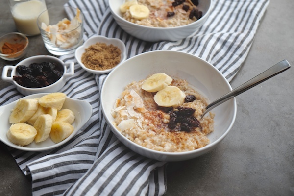 Coconut Steel Cut Oats made with coconut milk in the rice cooker! Find the recipe on Shutterbean.com!