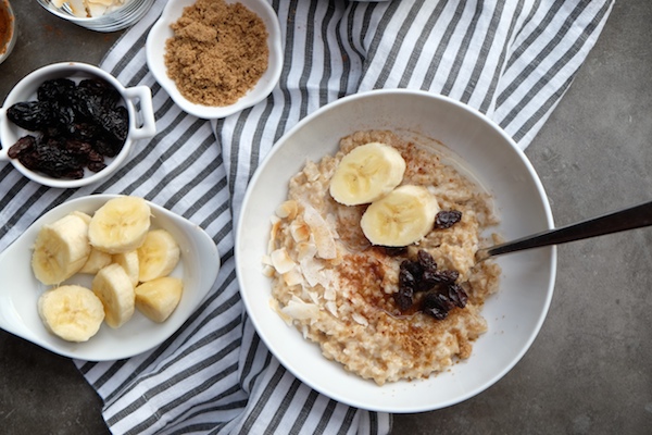 Coconut Steel Cut Oats made with coconut milk in the rice cooker! Find the recipe on Shutterbean.com!