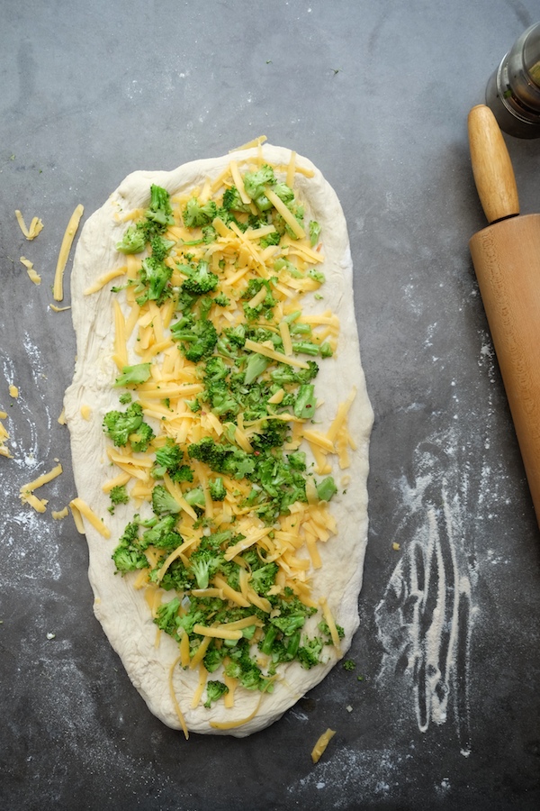 Transform store bought pizza dough into Broccoli Cheddar Rolls. It makes for a perfect weeknight dinner! Recipe on Shutterbean.com 