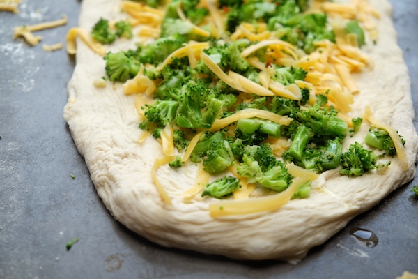 Transform store bought pizza dough into Broccoli Cheddar Rolls. It makes for a perfect weeknight dinner! Recipe on Shutterbean.com 