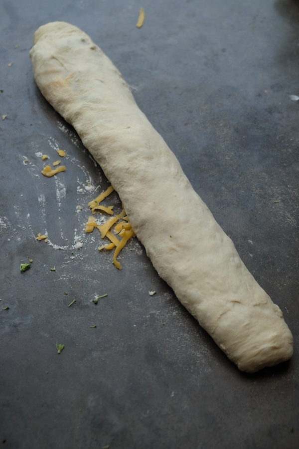 Transform store bought pizza dough into Broccoli Cheddar Rolls. It makes for a perfect weeknight dinner! Recipe on Shutterbean.com 