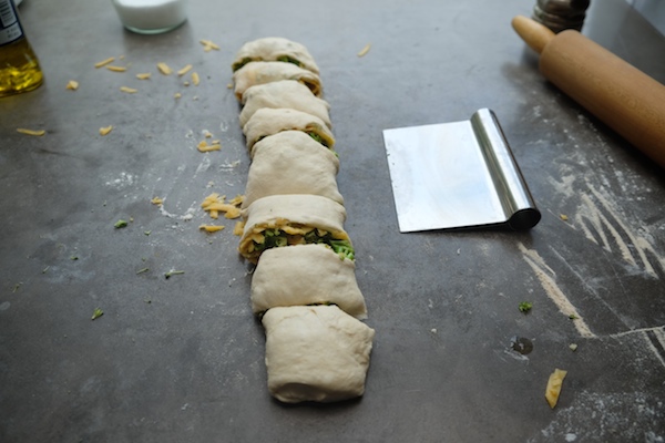 Transform store bought pizza dough into Broccoli Cheddar Rolls. It makes for a perfect weeknight dinner! Recipe on Shutterbean.com 