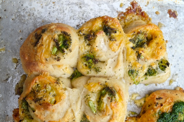 Transform store bought pizza dough into Broccoli Cheddar Rolls. It makes for a perfect weeknight dinner! Recipe on Shutterbean.com 