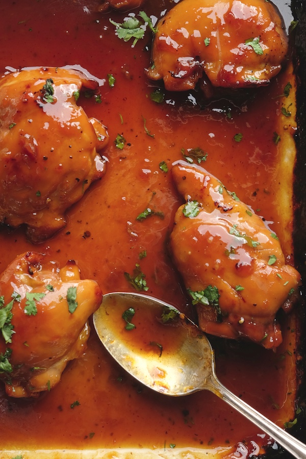 The most delicious & simple Apricot Glazed Chicken Thigh recipe can be found at Shutterbean.com! 