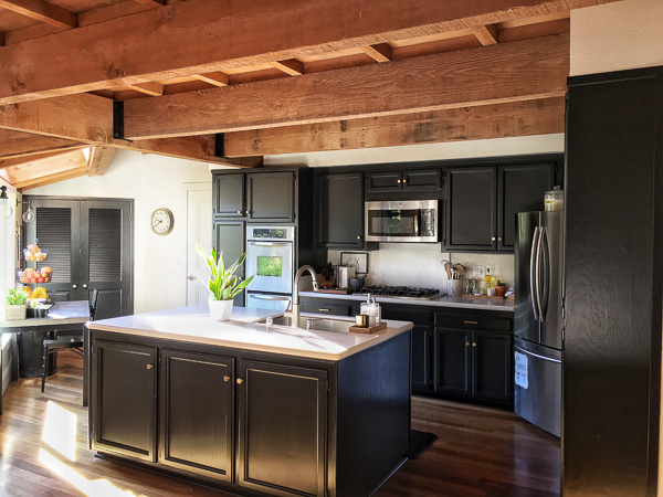 See how Tracy of Shutterbean transforms her taupe kitchen cabinets to BLACK. Around the House: The Kitchen After photos are on Shutterbean.com!