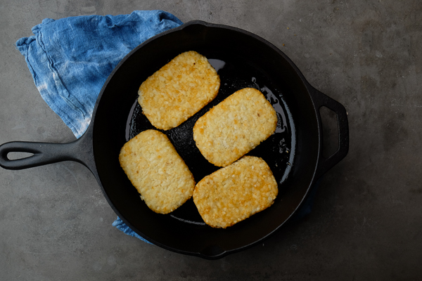 What makes this The Ultimate Breakfast Sandwich? The hash browns that sandwich homemade breakfast sausage, egg & cheese. Find the recipe on Shutterbean.com!