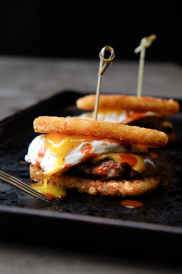 What makes this The Ultimate Breakfast Sandwich? The hash browns that sandwich homemade breakfast sausage, egg & cheese. Find the recipe on Shutterbean.com!