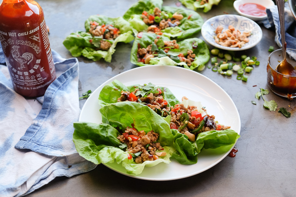Chicken Lettuce Cups are a healthy low carb dinner option that comes together so easily. Find the recipe at Shutterbean.com!