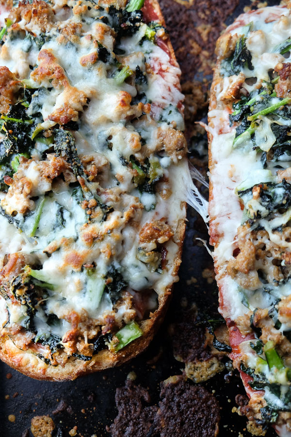 Sausage & Kale French Bread Pizzas are sure to be a crowd pleaser around the dinner table. Find the recipe at Shutterbean.com