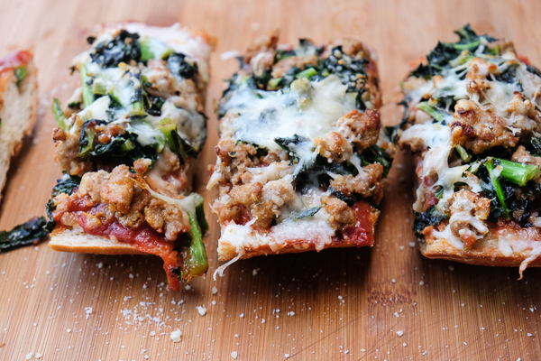 Sausage & Kale French Bread Pizzas are sure to be a crowd pleaser around the dinner table. Find the recipe at Shutterbean.com