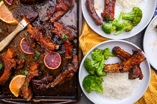 Orange Soy Glazed Ribs can be made easily in the oven. No grill required. Find the recipe on Shutterbean.com!