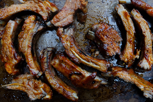 Orange Soy Glazed Ribs can be made easily in the oven. No grill required. Find the recipe on Shutterbean.com!