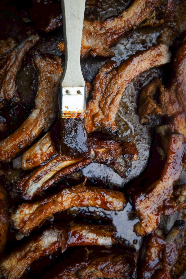 Orange Soy Glazed Ribs can be made easily in the oven. No grill required. Find the recipe on Shutterbean.com!