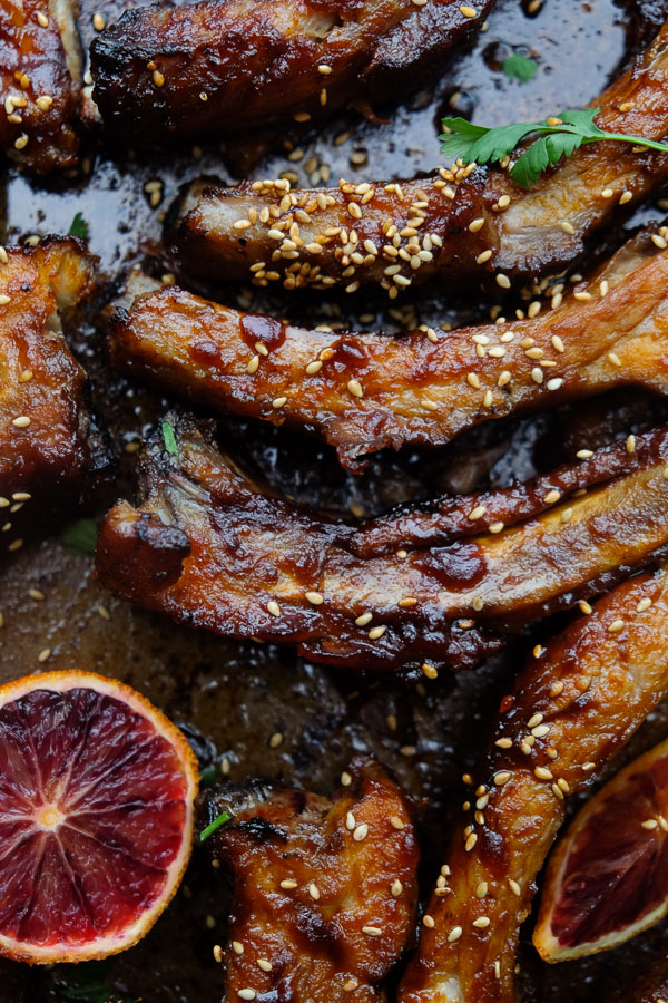 Orange Soy Glazed Ribs can be made easily in the oven. No grill required. Find the recipe on Shutterbean.com!