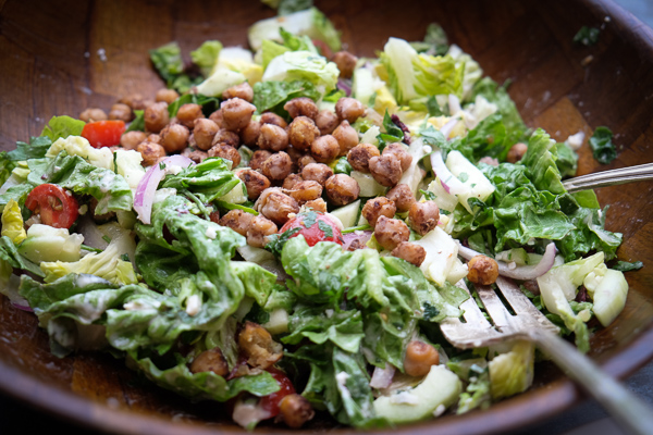 Chopped Salad with Spiced Chickpeas made with a lemon tahini dressing. Find the recipe on Shutterbean.com!