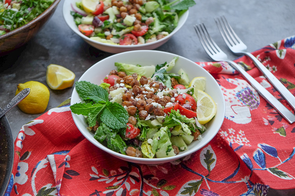 Chopped Salad with Spiced Chickpeas made with a lemon tahini dressing. Find the recipe on Shutterbean.com!