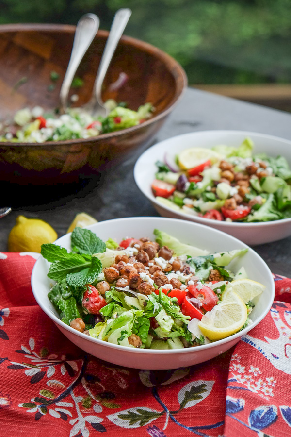 Chopped Salad with Spiced Chickpeas made with a lemon tahini dressing. Find the recipe on Shutterbean.com!