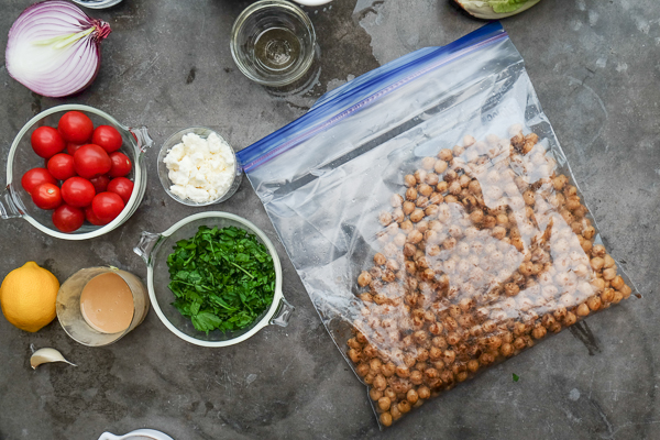 Chopped Salad with Spiced Chickpeas made with a lemon tahini dressing. Find the recipe on Shutterbean.com!