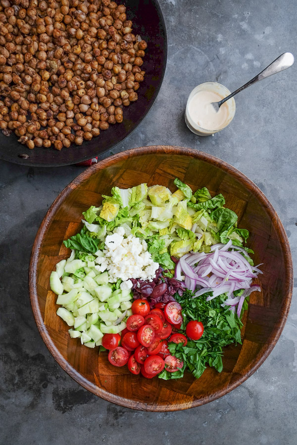 Chopped Salad with Spiced Chickpeas made with a lemon tahini dressing. Find the recipe on Shutterbean.com!