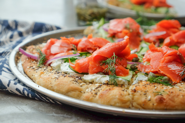 Lox Bagel Pizza- Perfect for weeknight dinners/afternoon brunches and parties! Find the recipe on Shutterbean.com!