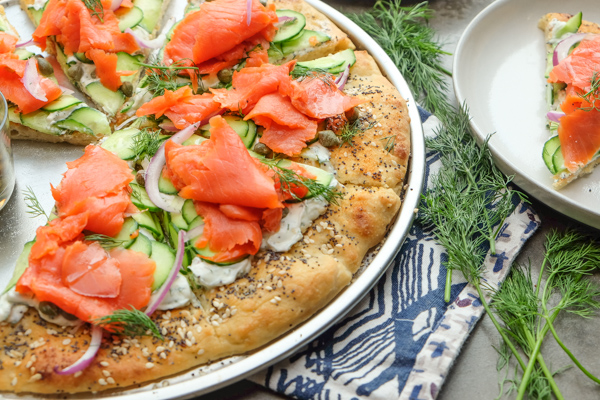 Lox Bagel Pizza- Perfect for weeknight dinners/afternoon brunches and parties! Find the recipe on Shutterbean.com!