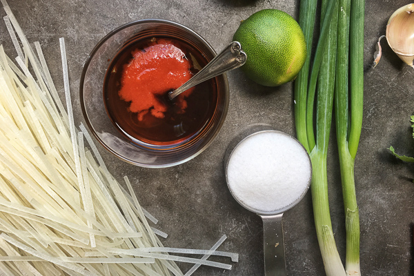 Spicy Asian Noodle Salad with a healthy dinner option for the Summer. Find the recipe on Shutterbean.com!