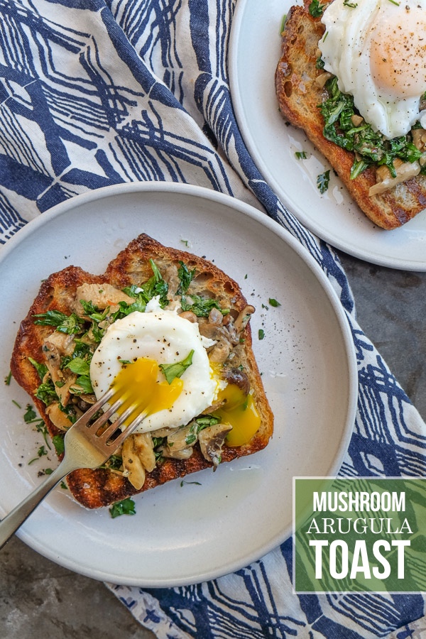 Creamy Mushroom Arugula Toast with Poached Eggs. Find the recipe on Shutterbean.com