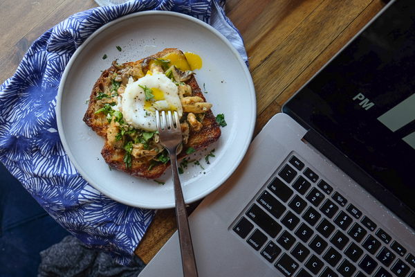 Creamy Mushroom Arugula Toast with Poached Eggs. Find the recipe on Shutterbean.com