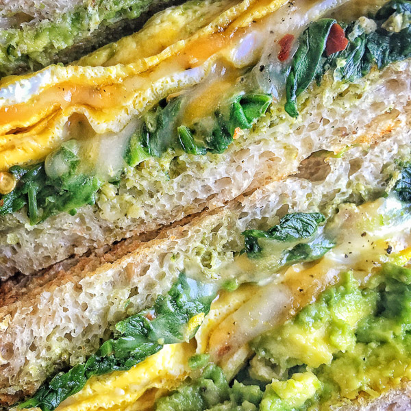 Spinach Egg Breakfast Sandwich is a healthy way to fill you up in the morning. Find the recipe on Shutterbean.com
