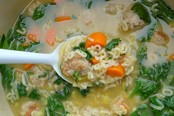 Spring Minestrone with Chicken Meatballs is a perfect soup for those chilly Spring days. Find the recipe on Shutterbean.com!