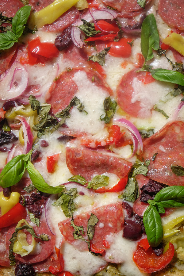 Turn the classic muffuletta sandwich into a pizza with this Muffuletta Pizza. Find the recipe on Shutterbean.com!