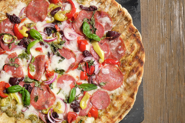 Turn the classic muffuletta sandwich into a pizza with this Muffuletta Pizza. Find the recipe on Shutterbean.com!