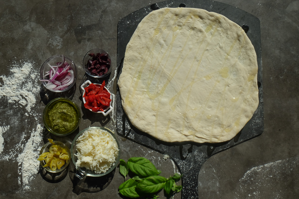 Turn the classic muffuletta sandwich into a pizza with this Muffuletta Pizza. Find the recipe on Shutterbean.com!