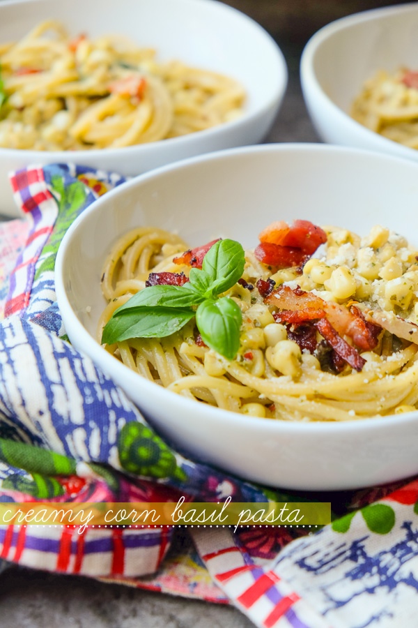 Creamy Corn Basil Pasta studded with crispy bacon. Find the recipe on Shutterbean.com