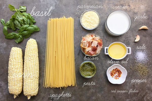 Creamy Corn Basil Pasta studded with crispy bacon. Find the recipe on Shutterbean.com