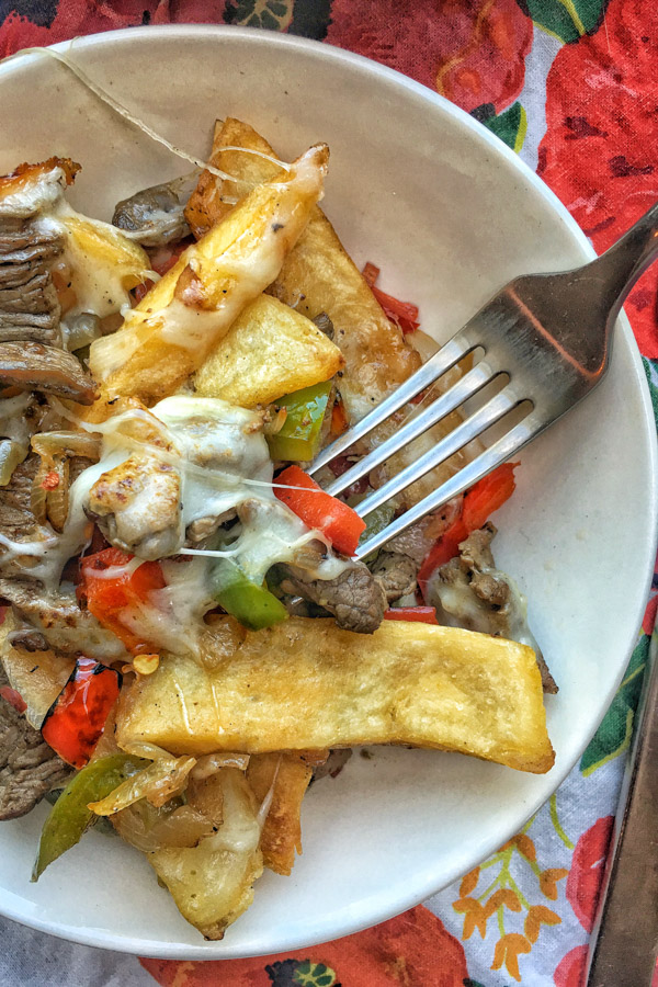 Ditch the bread in Philly Cheesesteak and use FRIES! Find the recipe for these Philly Cheesesteak Fries on Shutterbean.com!