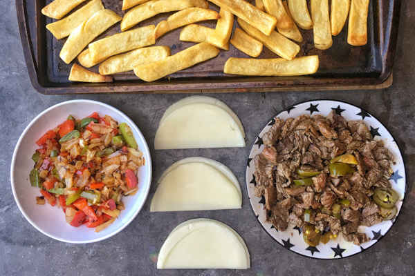 Ditch the bread in Philly Cheesesteak and use FRIES! Find the recipe for these Philly Cheesesteak Fries on Shutterbean.com!