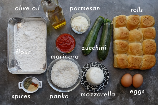 Zucchini Parmesan Sliders are a real crowd pleaser. Vegetarian too! Find the recipe on Shutterbean.com