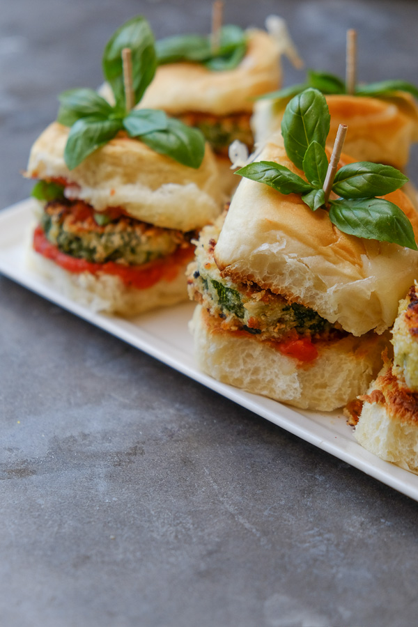 Zucchini Parmesan Sliders are a real crowd pleaser. Vegetarian too! Find the recipe on Shutterbean.com