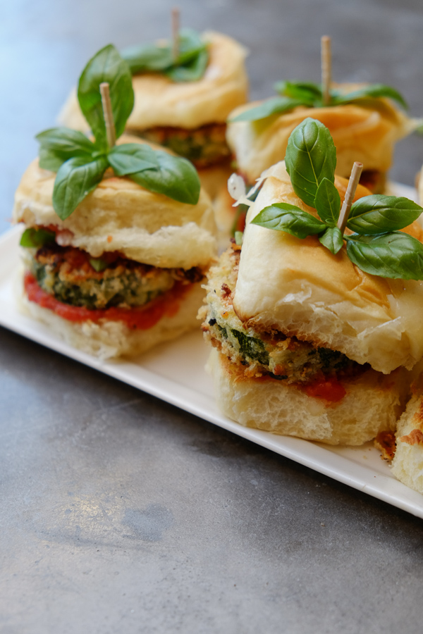 Zucchini Parmesan Sliders are a real crowd pleaser. Vegetarian too! Find the recipe on Shutterbean.com