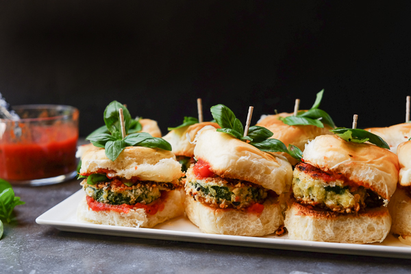 Zucchini Parmesan Sliders are a real crowd pleaser. Vegetarian too! Find the recipe on Shutterbean.com