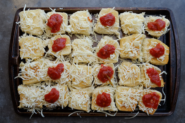 Zucchini Parmesan Sliders are a real crowd pleaser. Vegetarian too! Find the recipe on Shutterbean.com